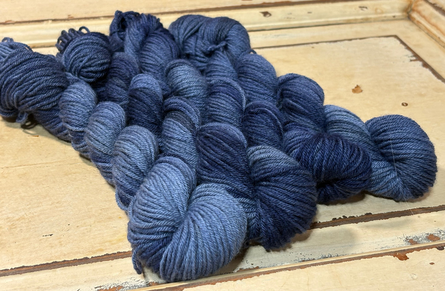 Hand-dyed yarn in Midnight Harbor by The Curious Skein - 80% merino wool/ 20% nylon. Inspired by dark denim.