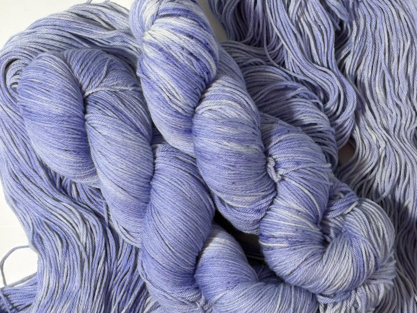 A soft lavender tonal hand-dyed yarn with gentle depth and a calm, misty finish. Wisteria Fog is quiet, elegant, and endlessly wearable.