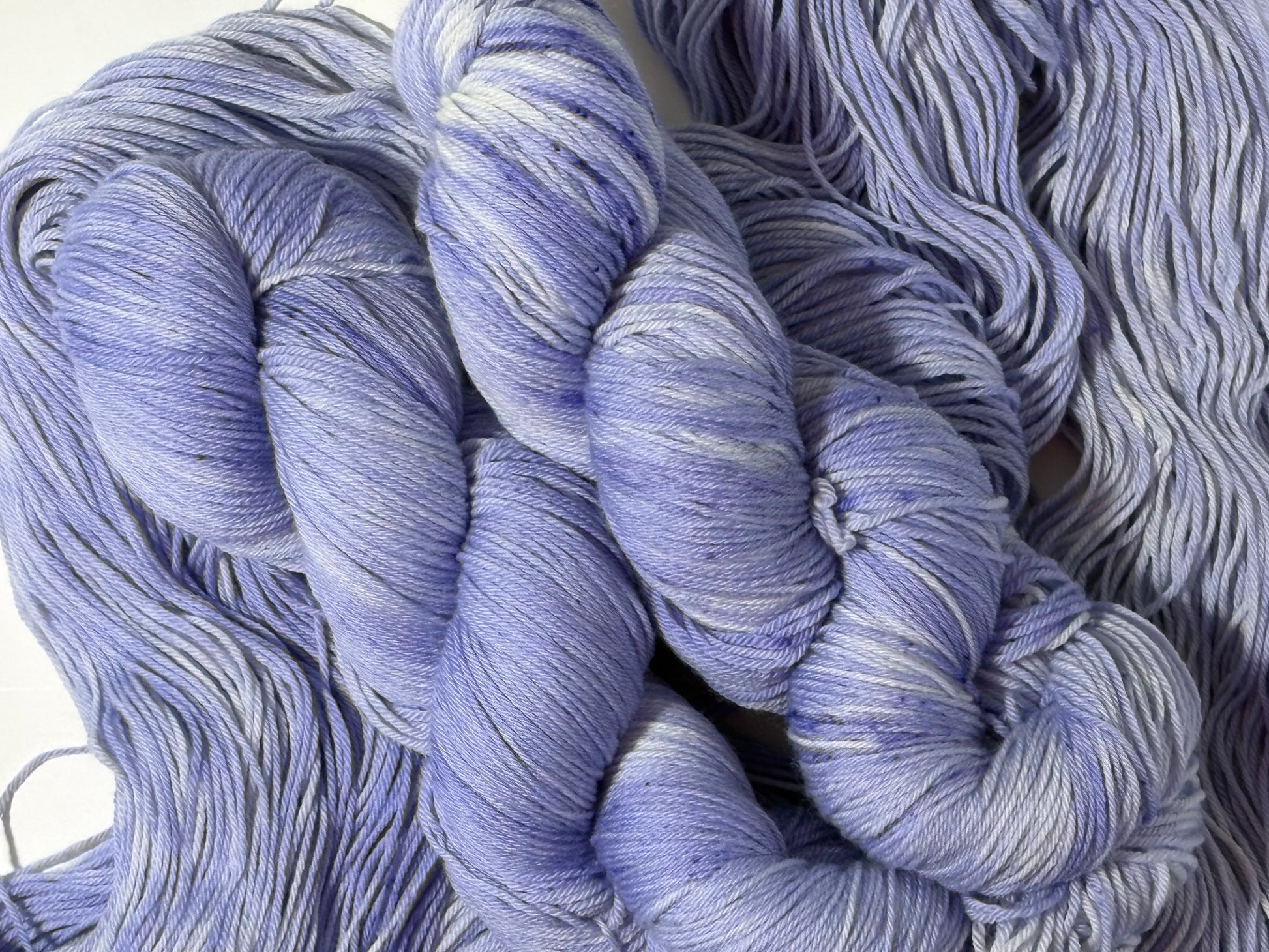 A soft lavender tonal hand-dyed yarn with gentle depth and a calm, misty finish. Wisteria Fog is quiet, elegant, and endlessly wearable.