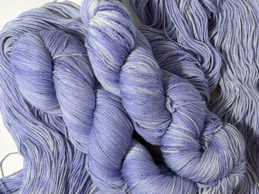 A soft lavender tonal hand-dyed yarn with gentle depth and a calm, misty finish. Wisteria Fog is quiet, elegant, and endlessly wearable.