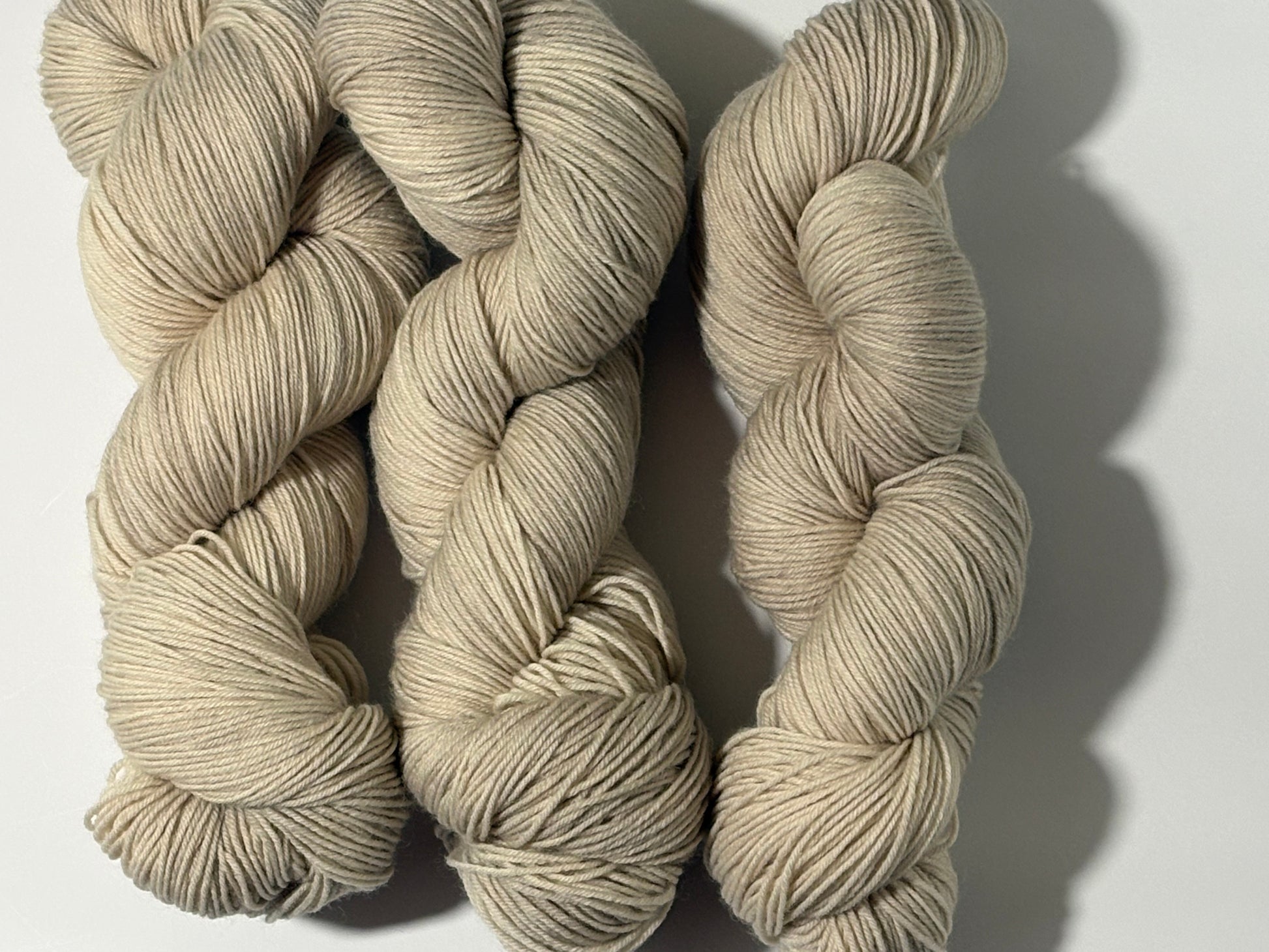 A warm, natural beige hand-dyed yarn inspired by aged paper and linen. Parchment is a soft, grounded neutral designed to pair beautifully with everything.