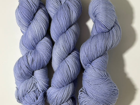 A soft lavender hand-dyed tonal yarn with gentle depth and a calm, misty finish. Wisteria Fog is quiet, elegant, and endlessly wearable.