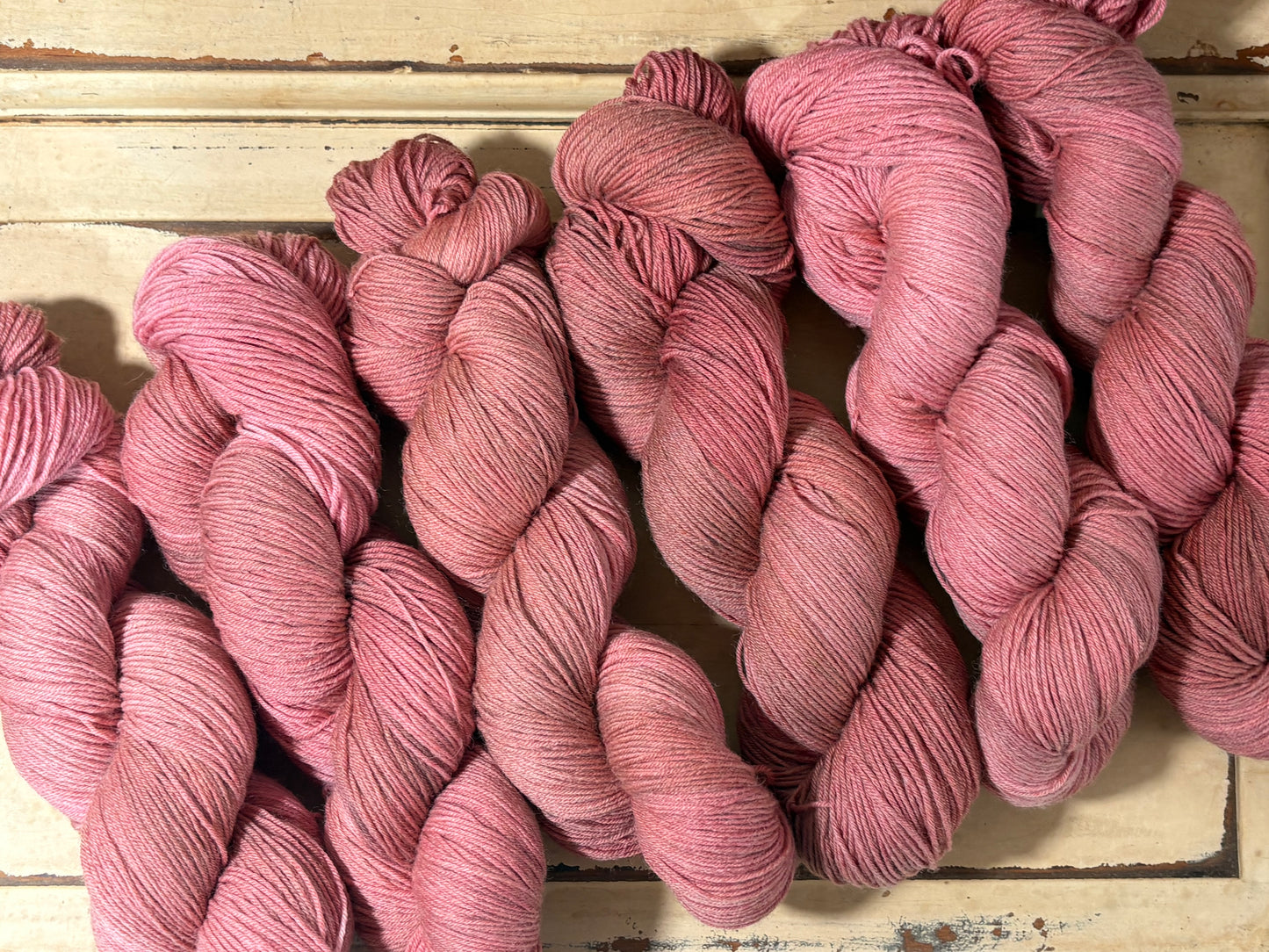 Discover Amber Hearth — a hand-dyed tonal yarn by The Curious Skein. Small batch, luxury merino nylon fingering weight yarn for knitting and crochet.