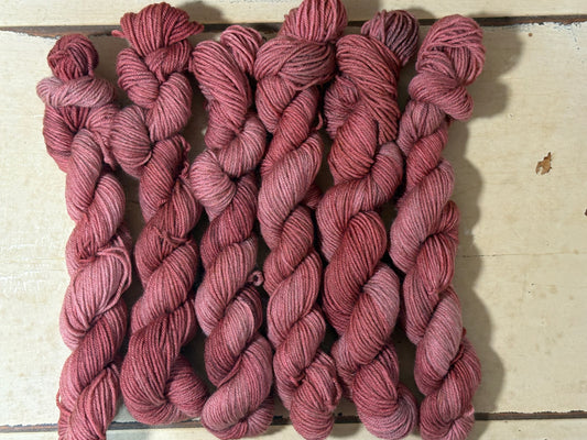 Discover Amber Hearth — a hand-dyed tonal yarn mini skein by The Curious Skein. Small batch, luxury merino nylon fingering weight yarn for knitting and crochet.