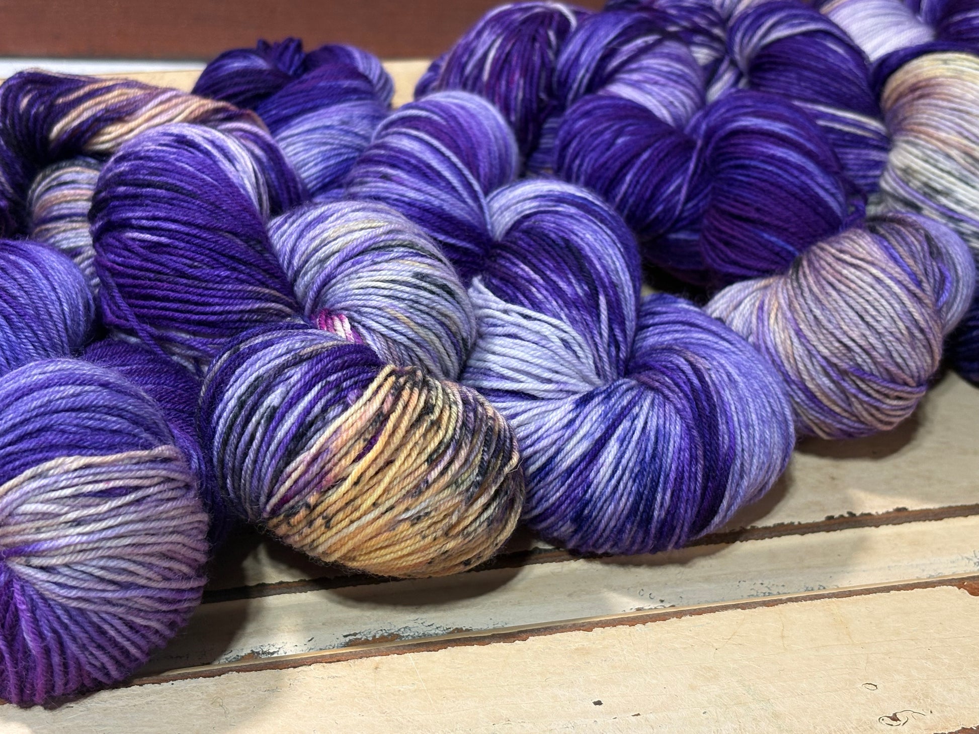 Amethyst Frost by The Curious Skein — an indie dyed multicolored yarn inspired by the glow of twilight on freshly fallen snow. Hand-dyed merino nylon fingering weight for knitting and crochet.