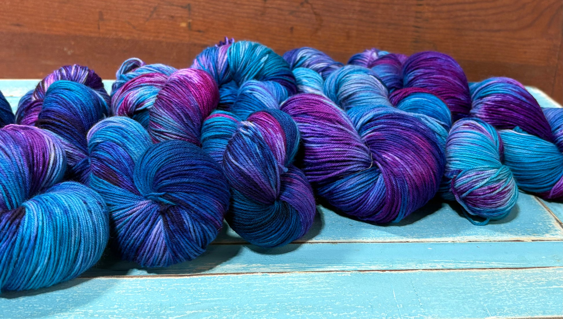Hand-dyed yarn in Arctic Frost- fingering weight merino nylon blend in frosty blue, pink and purple.