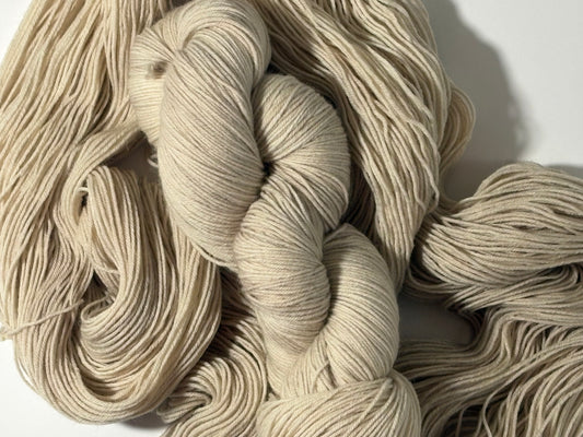 A warm, natural beige hand-dyed yarn inspired by aged paper and linen. Parchment is a soft, grounded neutral designed to pair beautifully with everything.