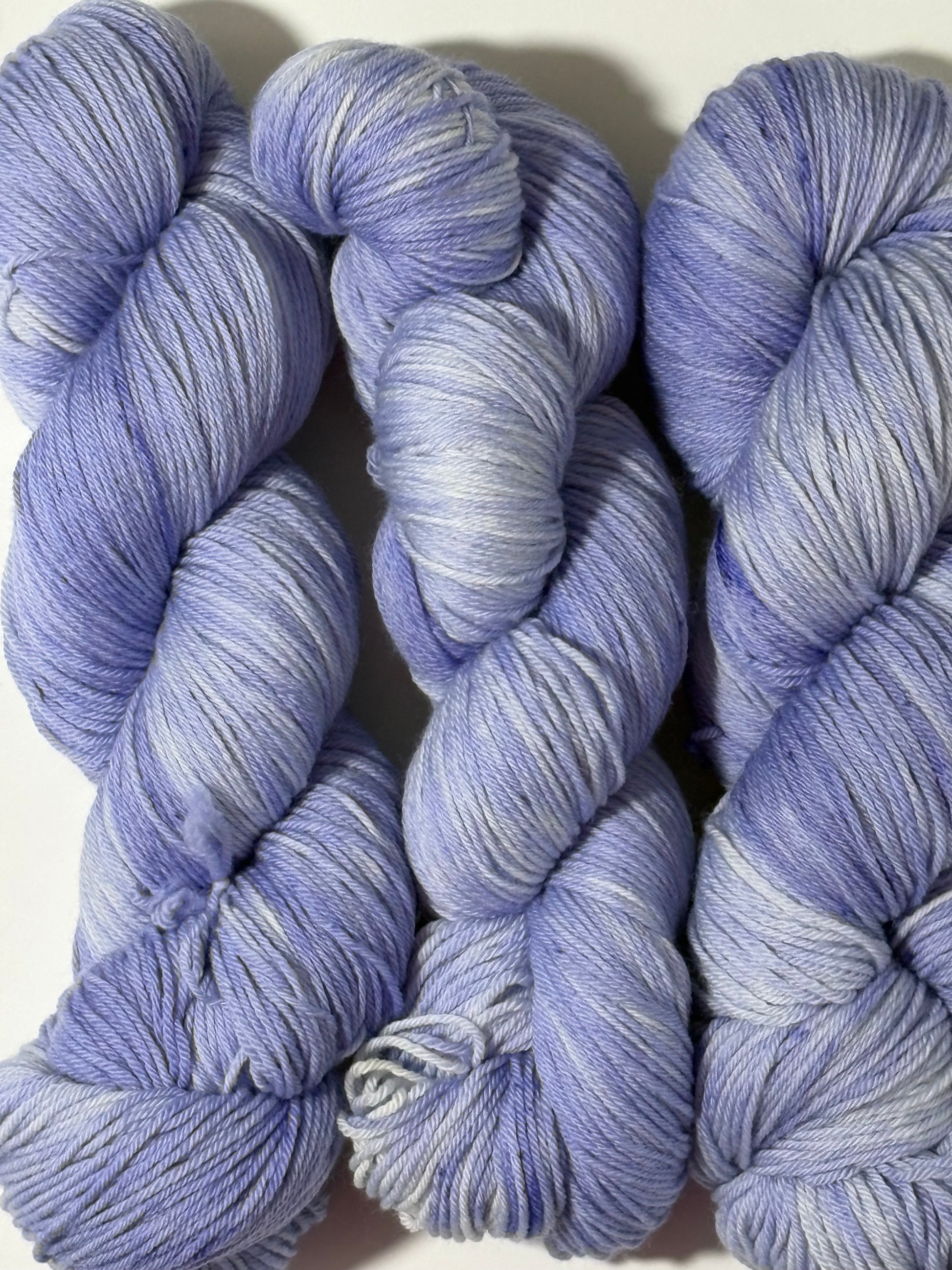 A soft lavender tonal hand-dyed yarn with gentle depth and a calm, misty finish. Wisteria Fog is quiet, elegant, and endlessly wearable.