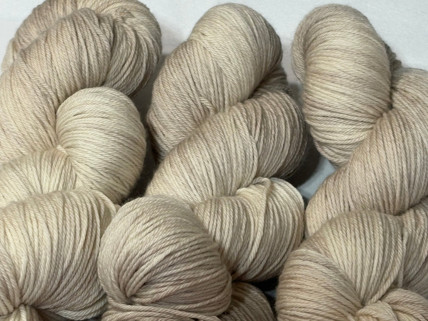 A warm, natural beige hand-dyed tonal yarn inspired by aged paper and linen. Parchment is a soft, grounded neutral designed to pair beautifully with everything.