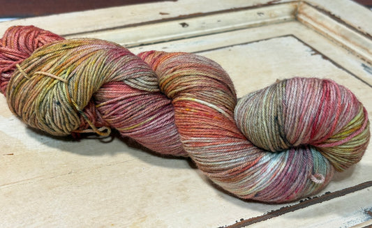 Hand-dyed yarn in Forest Floor by The Curious Skein - 80% merino wool/ 20% nylon. Inspired by autumn leaves scattered across the forest floor.