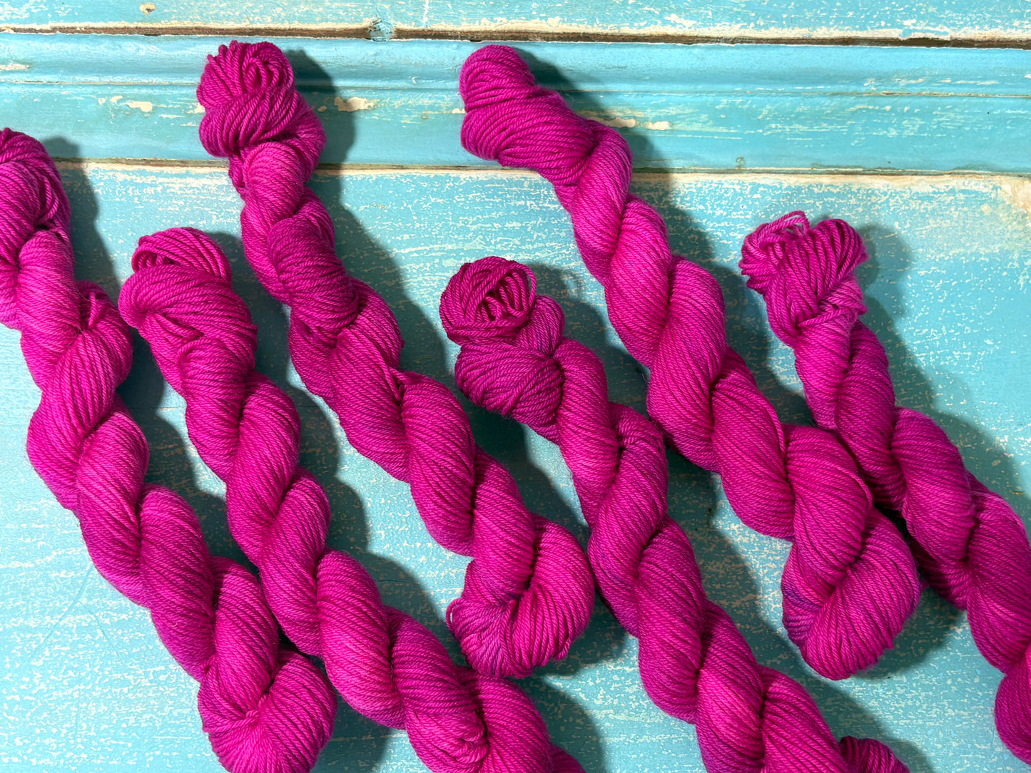 Discover Frosted Rose — a hand-dyed tonal yarn mini skein by The Curious Skein. Small batch, luxury merino nylon fingering weight yarn for knitting and crochet.