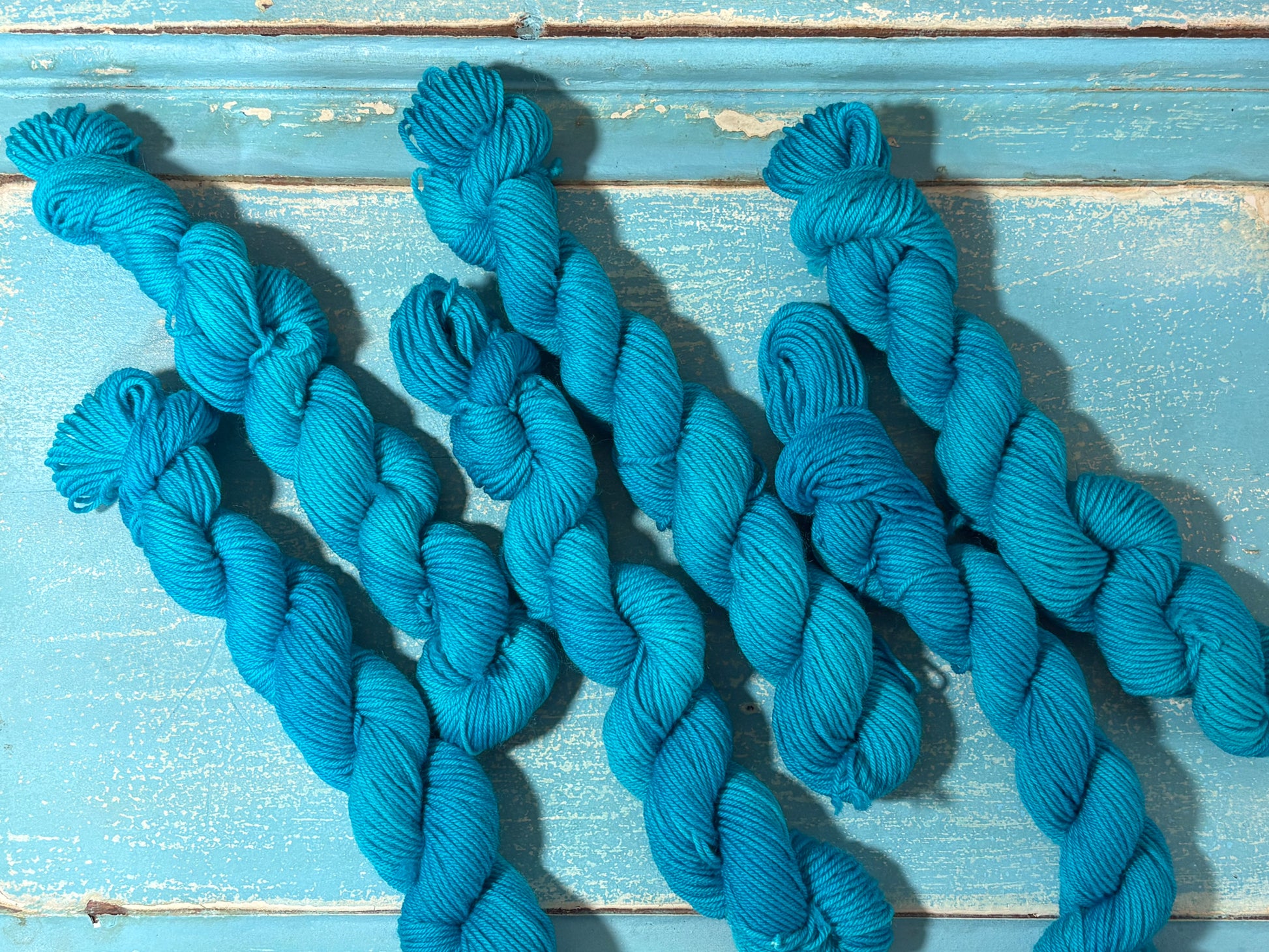 Discover Glacial Blue — a hand-dyed tonal mini skein yarn by The Curious Skein. Small batch, luxury merino nylon fingering weight yarn for knitting and crochet.