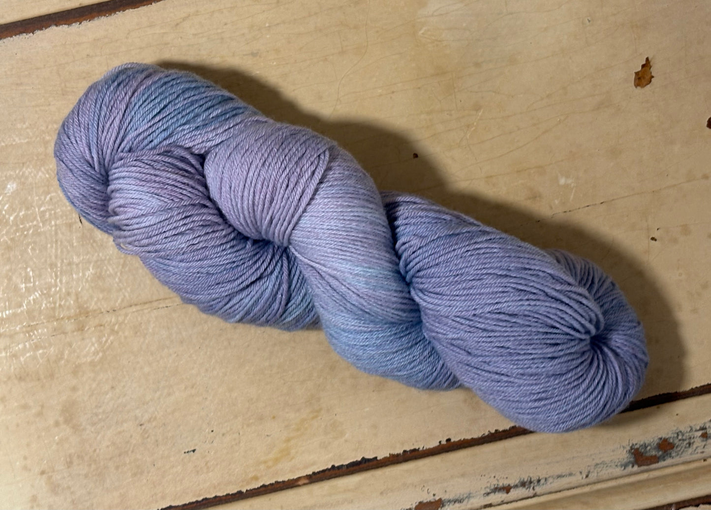 Indie dyed yarn in Inkberry Plum by The Curious Skein - 80% merino wool/ 20% nylon.
