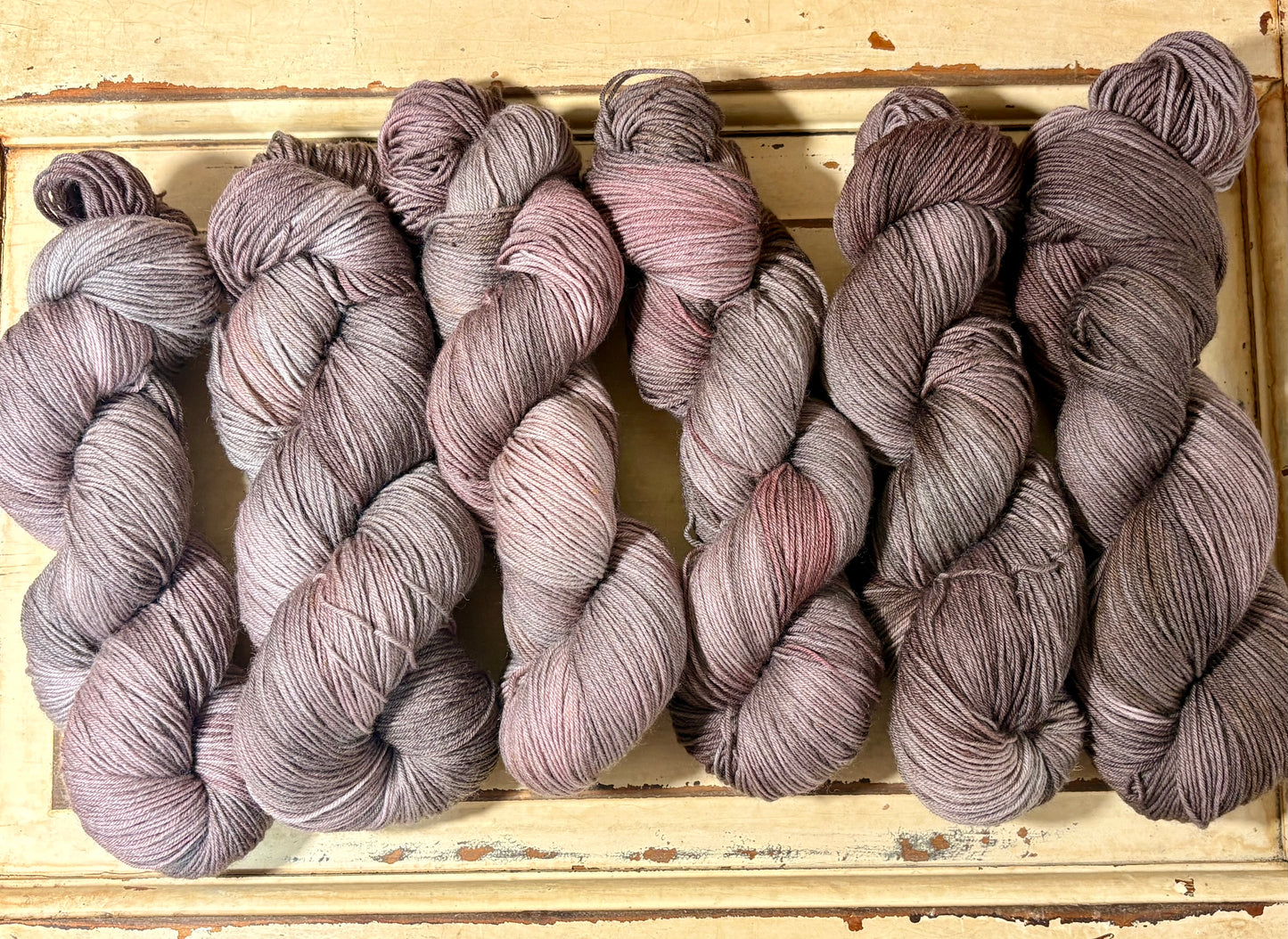 Discover Oak & Ember — a hand-dyed tonal yarn by The Curious Skein. Small batch, luxury merino nylon fingering weight yarn for knitting and crochet.