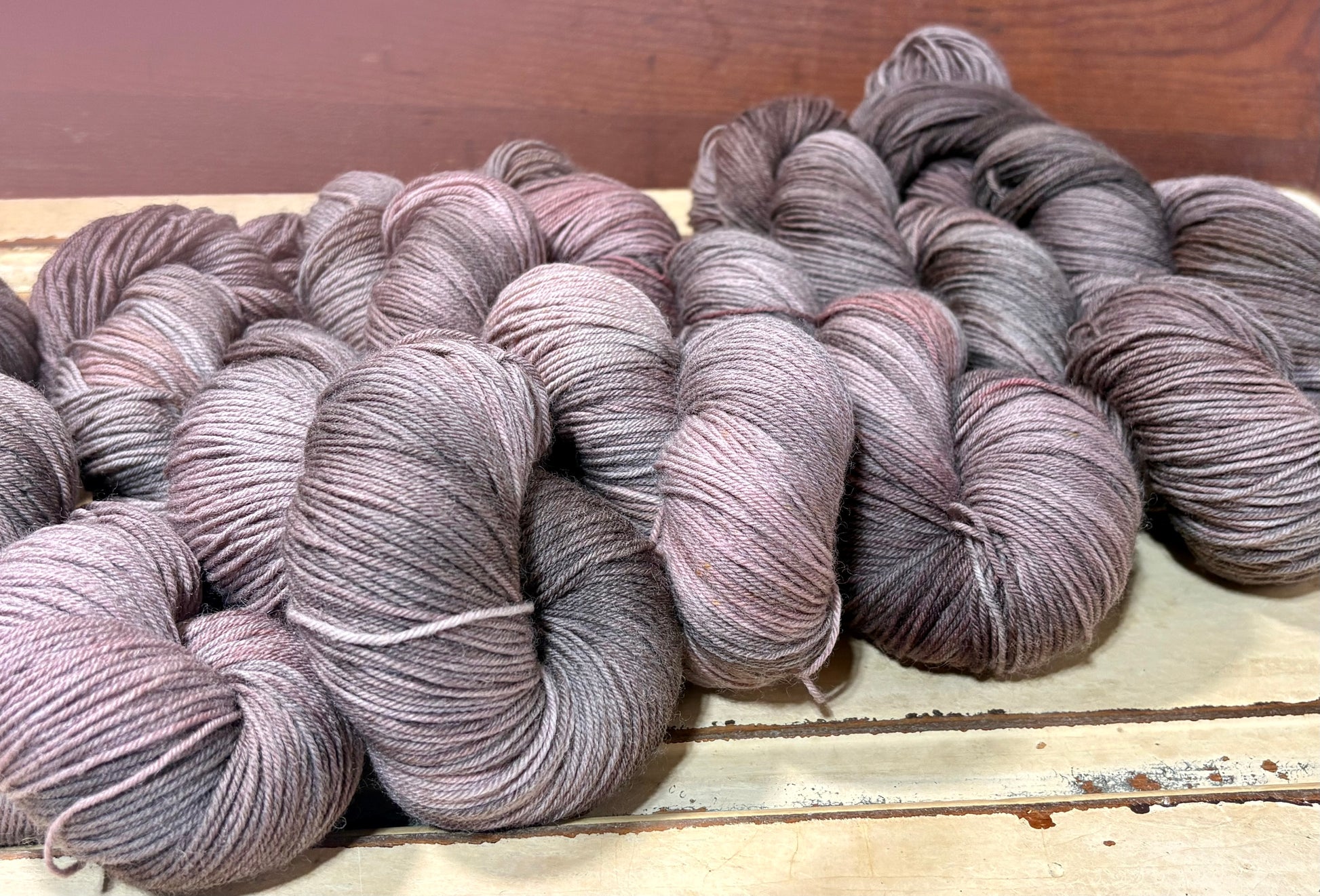 Discover Oak & Ember — a hand-dyed tonal yarn by The Curious Skein. Small batch, luxury merino nylon fingering weight yarn for knitting and crochet.
