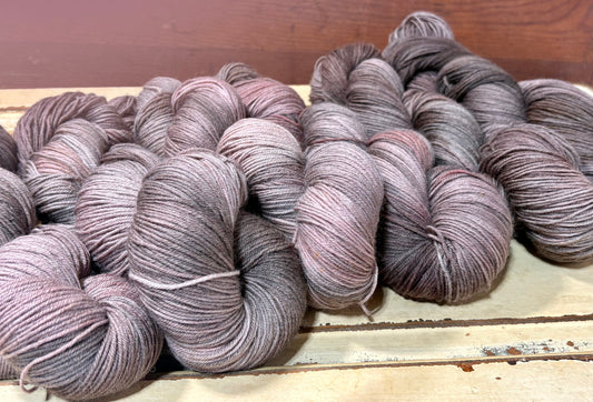 Discover Oak & Ember — a hand-dyed tonal yarn by The Curious Skein. Small batch, luxury merino nylon fingering weight yarn for knitting and crochet.