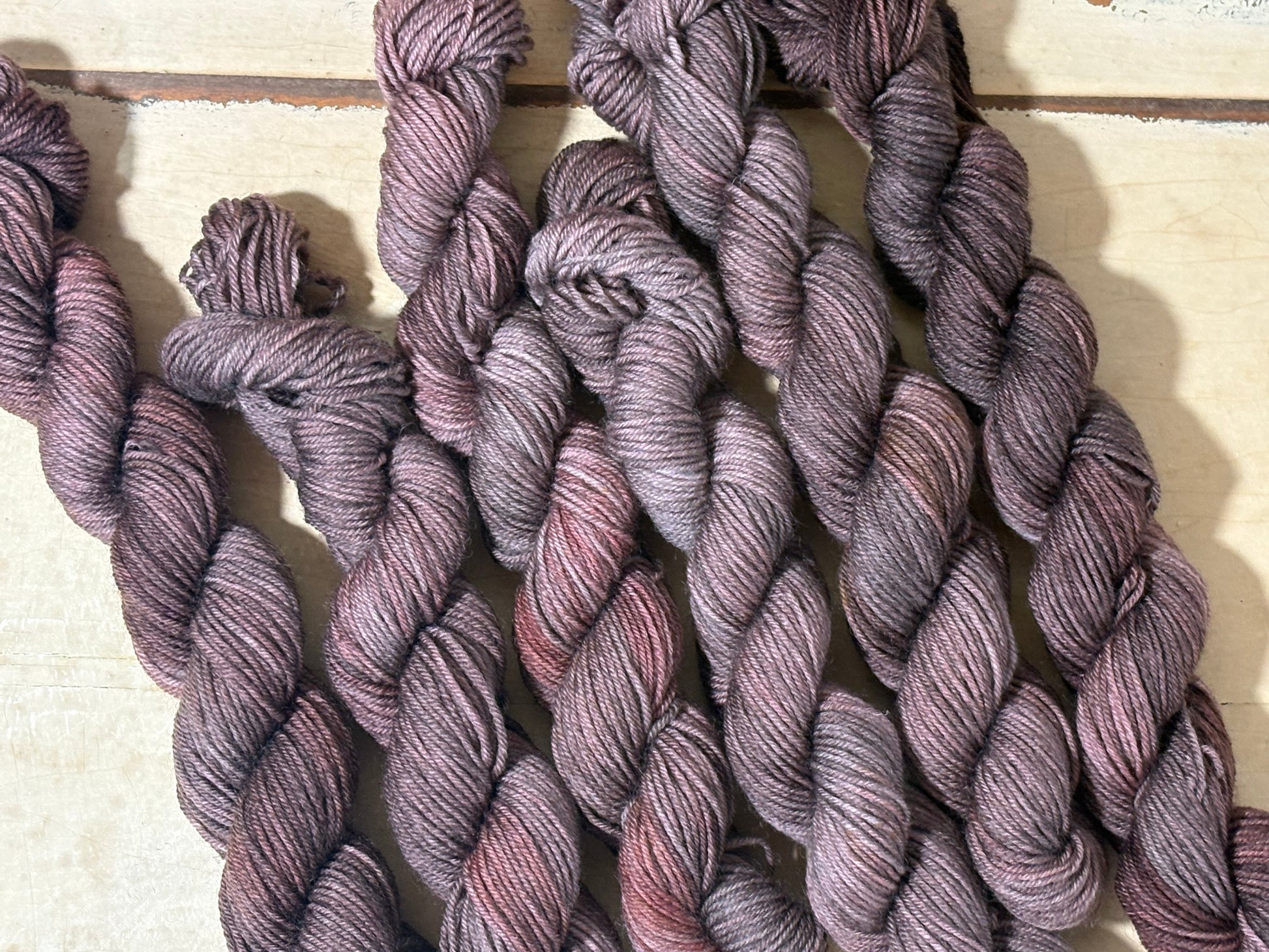 Discover Oak & Ember — a hand-dyed tonal yarn mini skein by The Curious Skein. Small batch, luxury merino nylon fingering weight yarn for knitting and crochet.