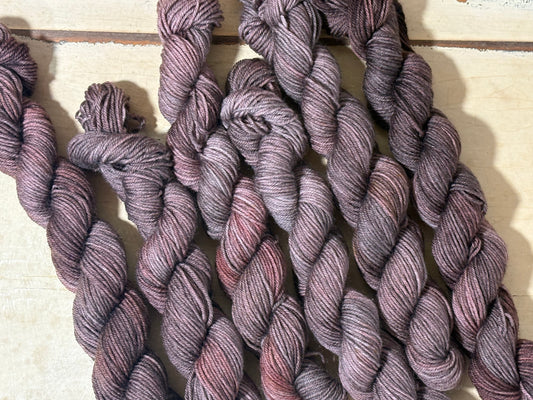 Discover Oak & Ember — a hand-dyed tonal yarn mini skein by The Curious Skein. Small batch, luxury merino nylon fingering weight yarn for knitting and crochet.