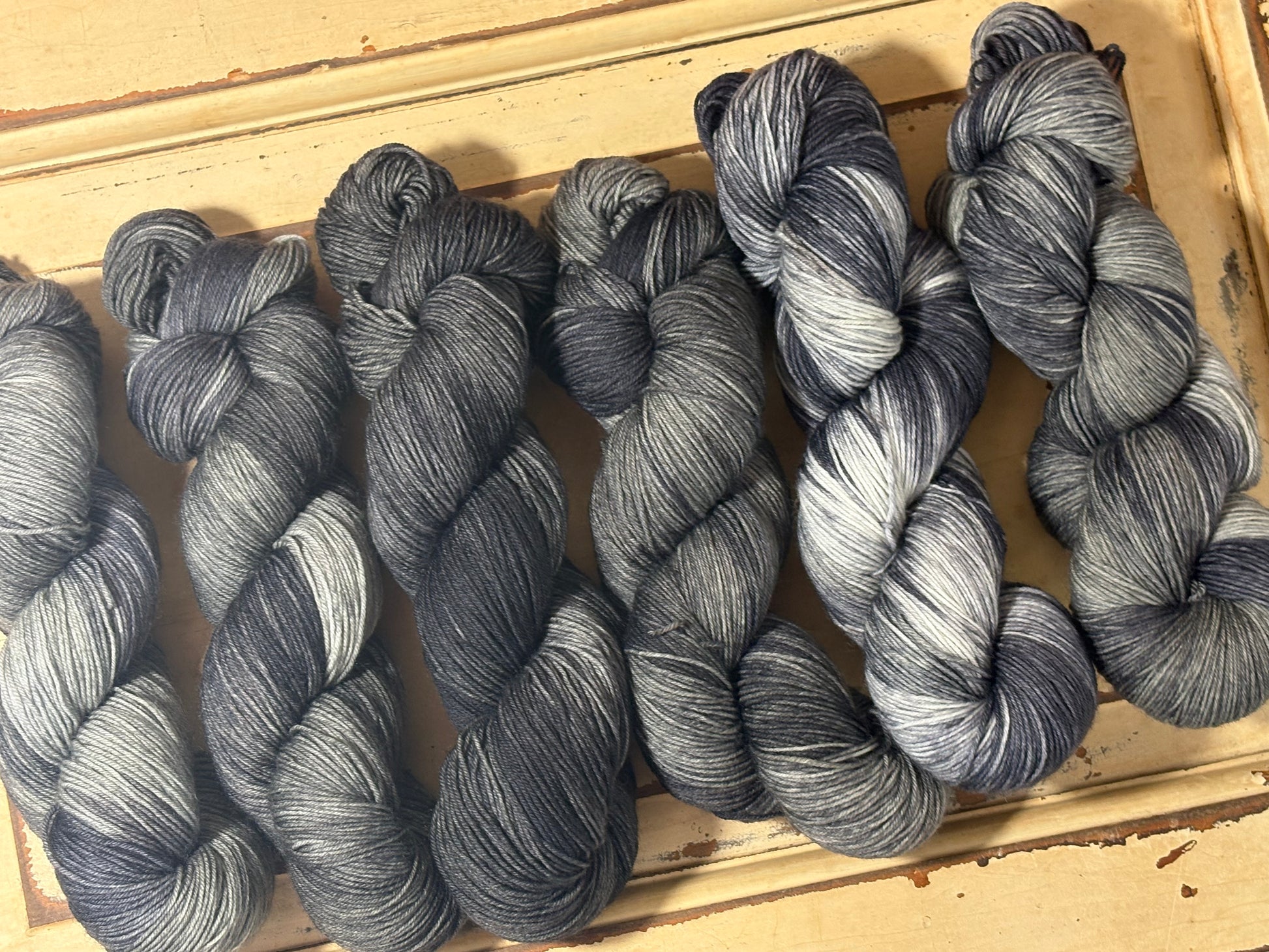 Discover Shadow Frost — a hand-dyed tonal yarn by The Curious Skein. Small batch, luxury merino nylon fingering weight yarn for knitting and crochet.