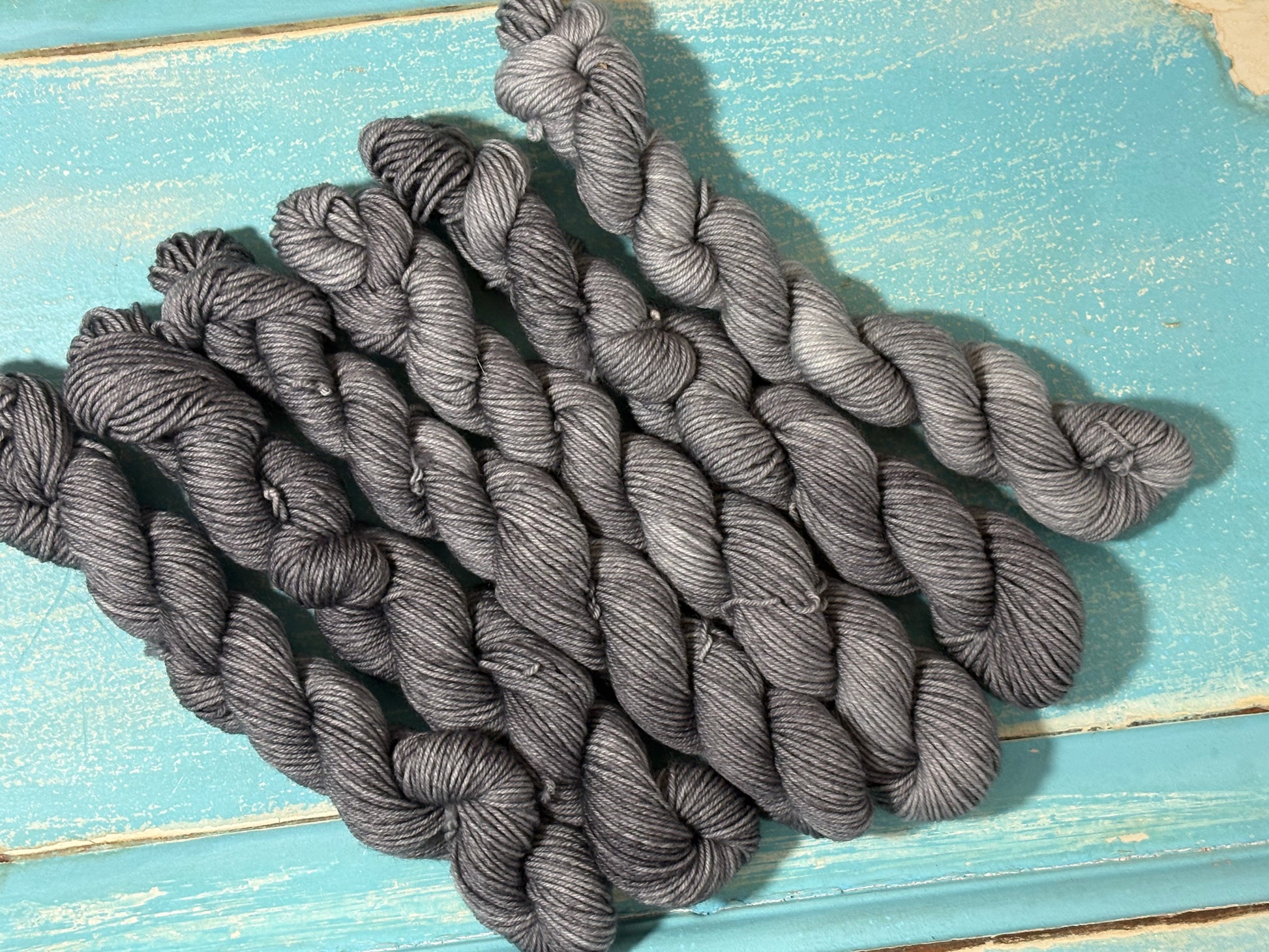 Discover Shadow Frost — a hand-dyed tonal yarn by The Curious Skein. Small batch, luxury merino nylon fingering weight yarn for knitting and crochet.