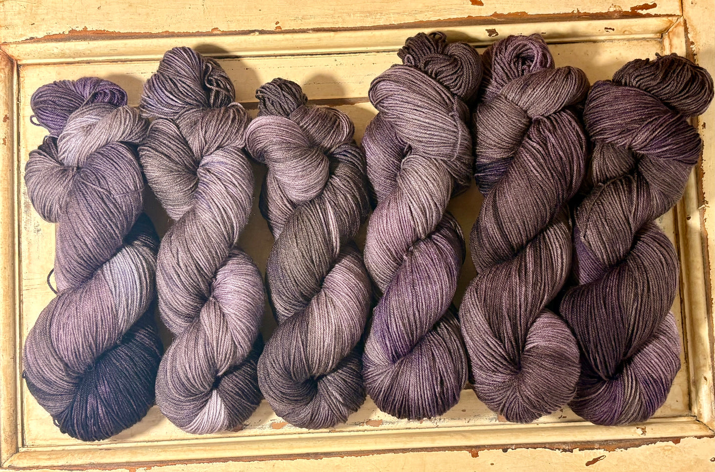 Smoke & Violet by The Curious Skein — a one-of-a-kind hand-dyed yarn. Unique small batch merino nylon fingering weight artisan yarn for knit and crochet.