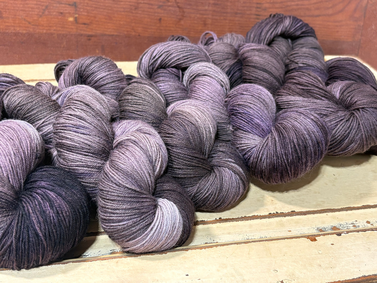 Smoke & Violet by The Curious Skein — a one-of-a-kind hand-dyed yarn. Unique small batch merino nylon fingering weight artisan yarn for knit and crochet.