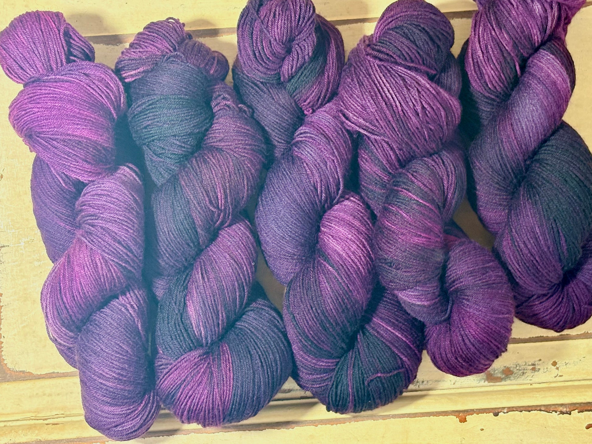 Discover Sugar Plum Velvet — a hand-dyed tonal yarn by The Curious Skein. Small batch, luxury merino wool fingering weight yarn for knitting and crochet.