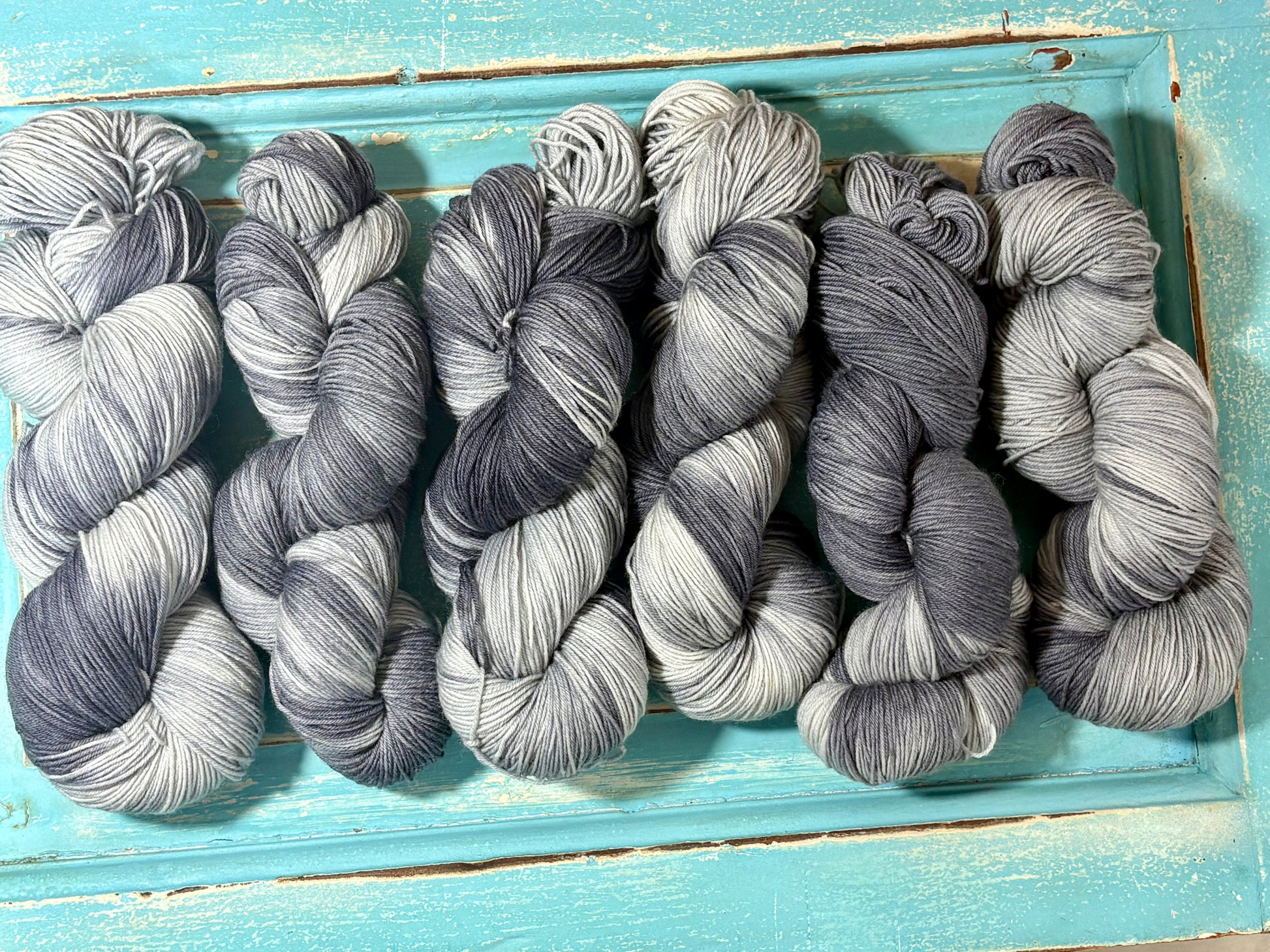 Winter's Breath by The Curious Skein — an indie dyed multicolored yarn inspired by warm breath meeting crisp winter air. Hand-dyed merino wool fingering weight yarn for knitting and crochet.